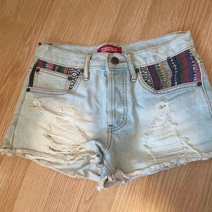 size 25 premium denim shorts with pattern pockets.
